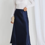 model wears a navy maxi skirt