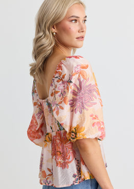 model wears a pink floral top