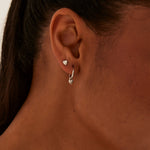 model wearing Heart Sleeper Stud Set Rhodium Earrings