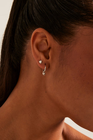 model wearing Heart Sleeper Stud Set Rhodium Earrings