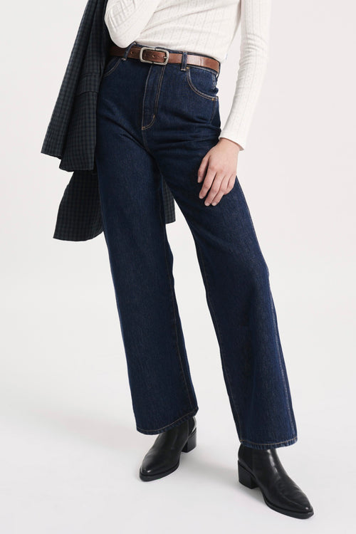 model wears blue wide leg jeans