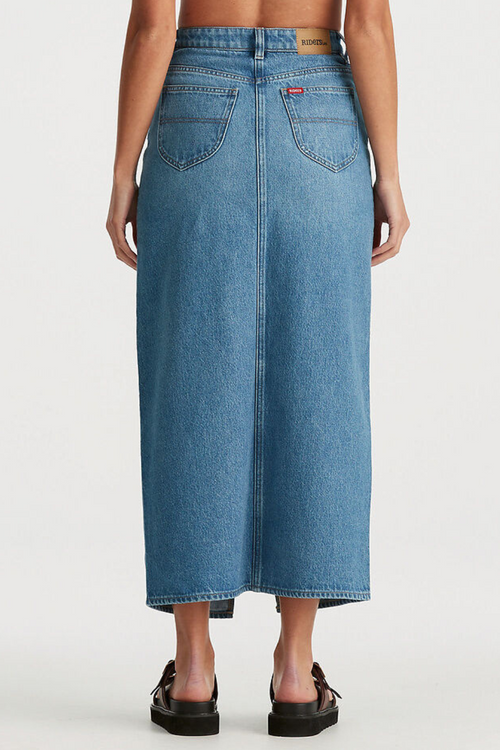 model wears blue denim maxi skirt