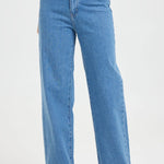 Woman wears high-rise blue wide-leg jeans with a fitted waist and relaxed leg, styled with a white graphic tee and white sneakers. The look is casual, fresh, and flattering.