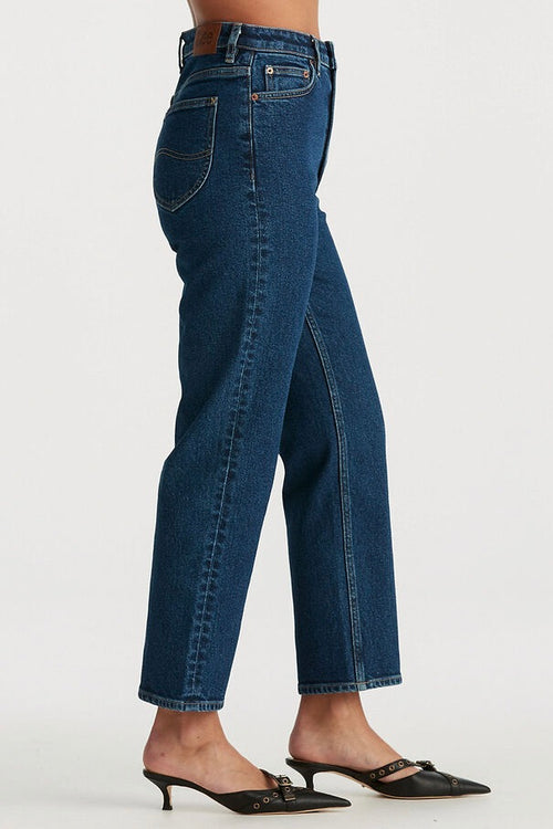 model wears blue jeans