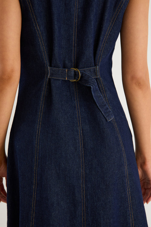 Denim dress with a belt on a plain background