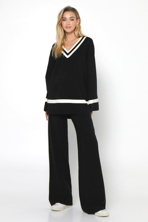 model wears a Black Knit Pant