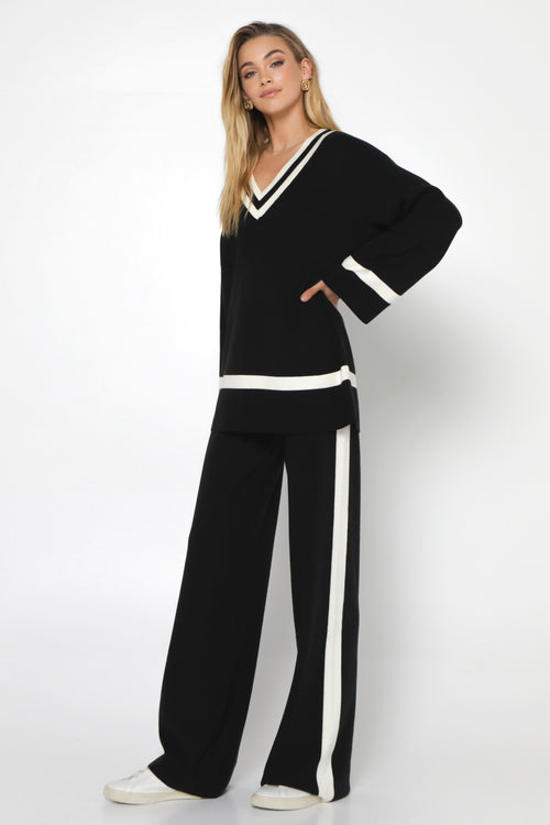 model wears a Black Knit Pant