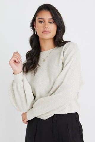 model wears a beige knit