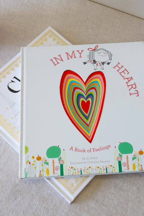 Book titled 'In My Heart' with a colorful heart illustration on a light surface.