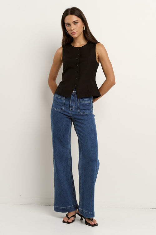 model wearing black linen vest
