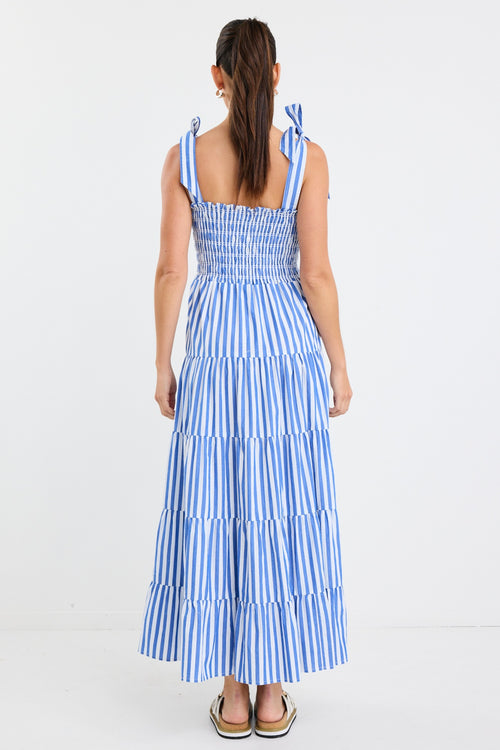 model wears a blue and white stripe maxi dress