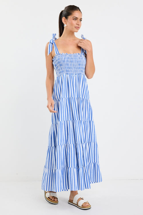 model wears a blue and white stripe maxi dress