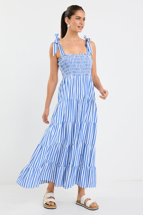 model wears a blue and white stripe maxi dress
