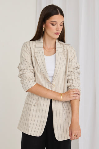 model wears a stripe beige blazer
