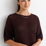 model wears a brown knit tee