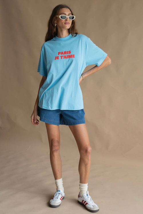 model wears a blue tee