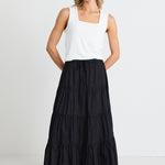 model wears a black maxi skirt 