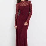 Woman wearing a burgundy lace dress on a white background