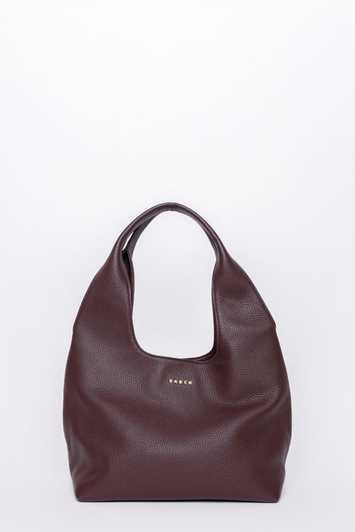 Brown leather handbag on a white background
