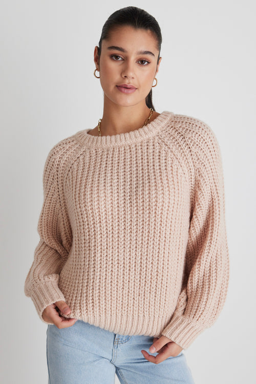 model wears a pink knit 