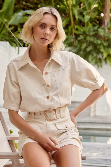 model wears a white denim shirt