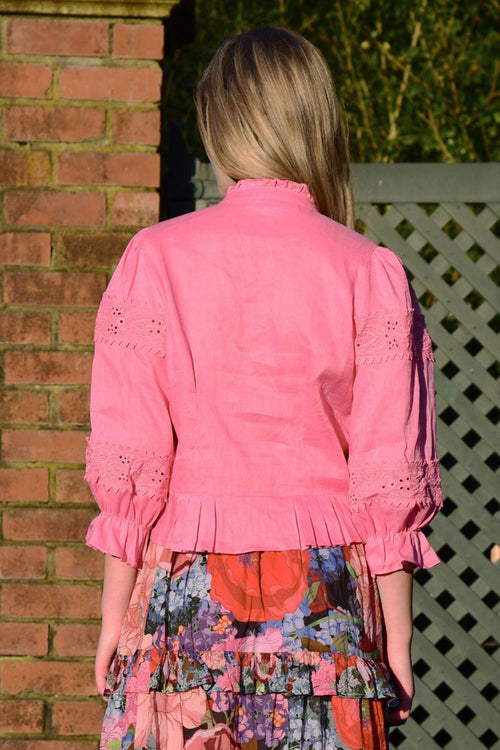 Model wears pink lace blouse