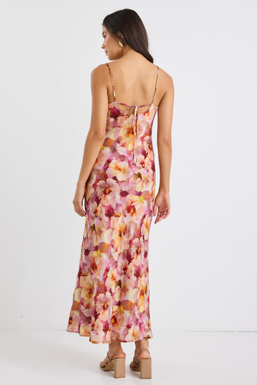 model wears a pink floral maxi dress