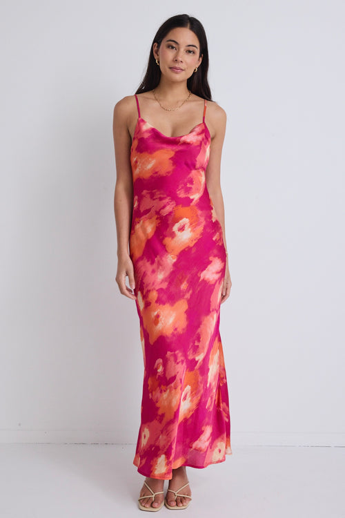 model wears a pink floral maxi dress