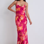 model wears a pink floral maxi dress