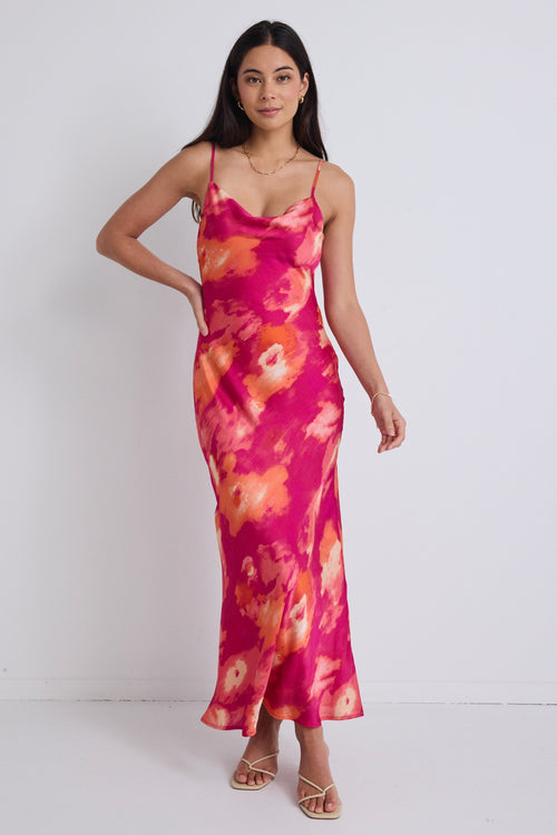 model wears a pink floral maxi dress