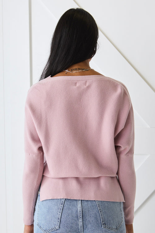 Model wears a pink knit