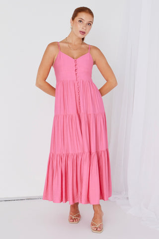 model wears a pink strappy maxi dress