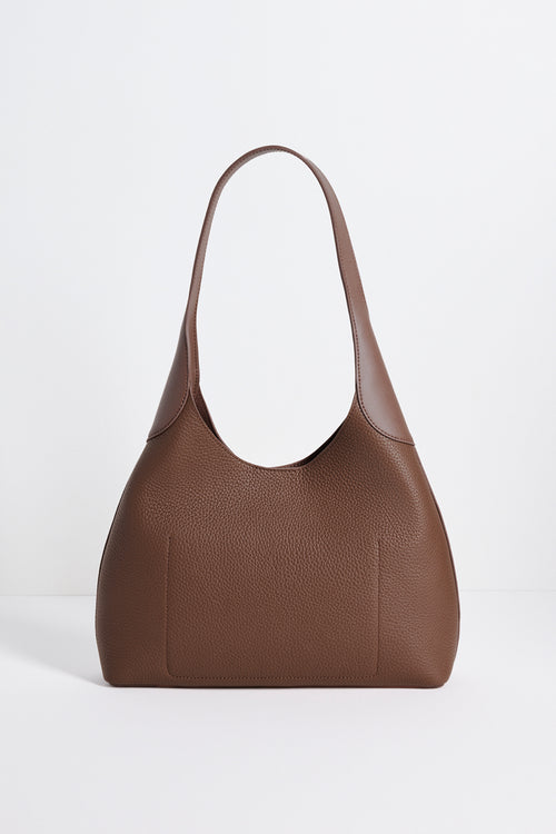 Brown leather handbag on a white background