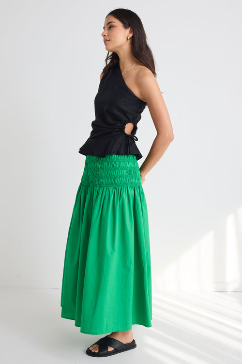 model wears a green poplin skirt