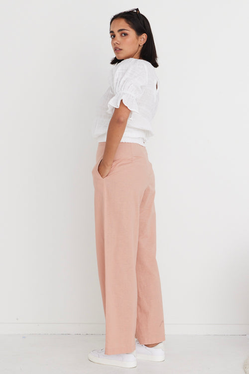 model wears pink linen pants