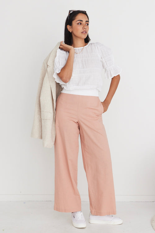 model wears pink linen pants