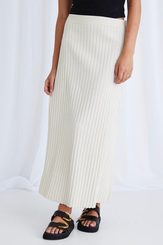 model wears a beige rib knit maxi skirt