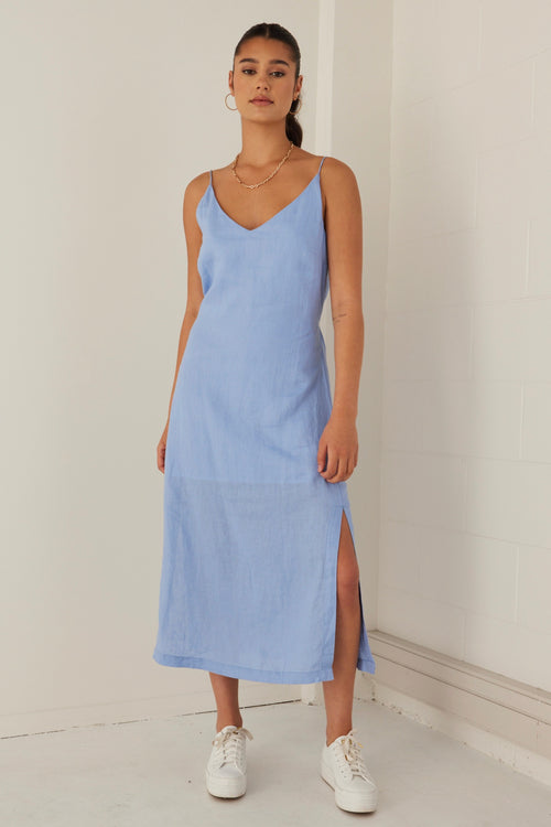 model wears a blue linen midi dress