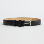 Slim black leather belt with a textured finish and a silver buckle, photographed on a white background
