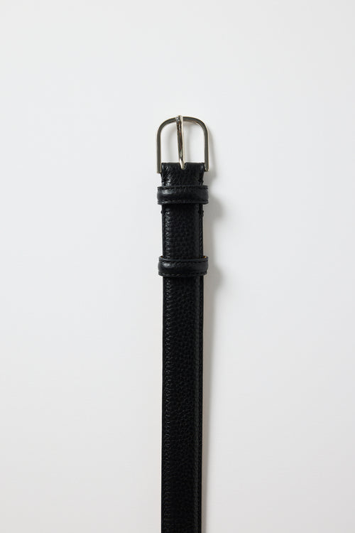 Slim black leather belt with a textured finish and a silver buckle, photographed on a white background