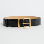Black belt with a gold buckle on a white background