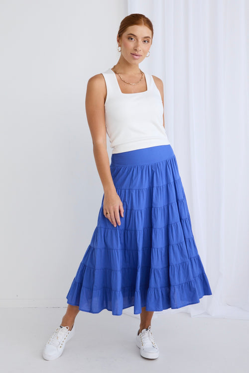 model wears a blue maxi skirt