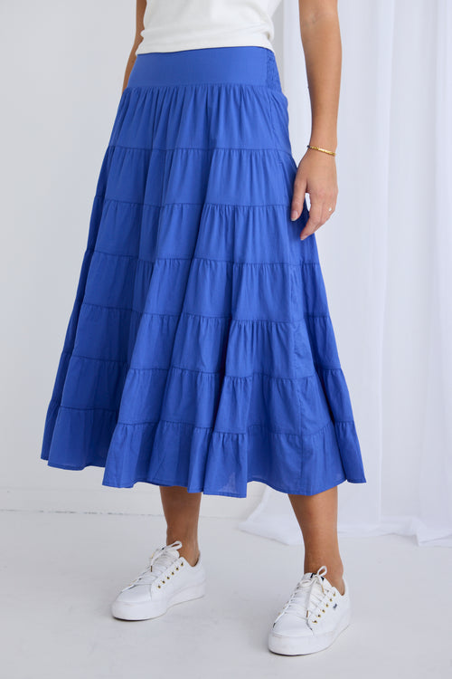 model wears a blue maxi skirt