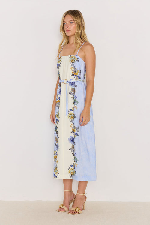 Woman wearing a floral dress with a white background