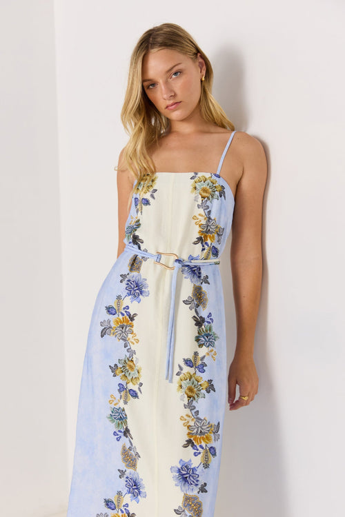 Woman wearing a floral dress with a white background