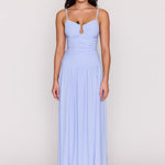 Woman wearing a light blue dress on a white background