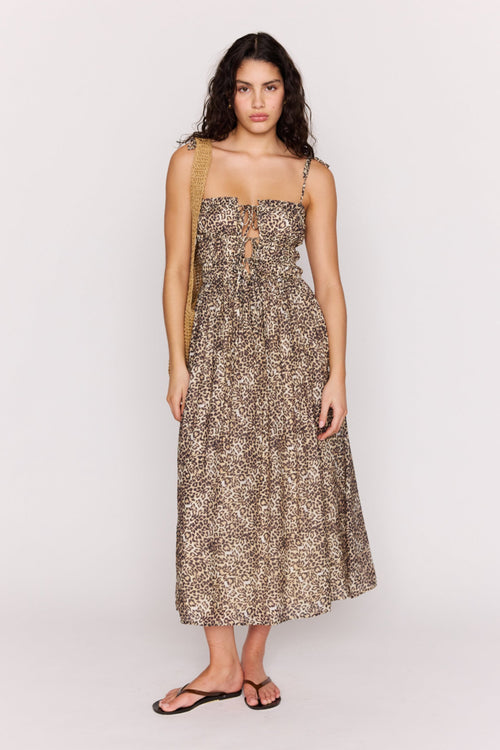 Woman wearing a floral dress on a white background