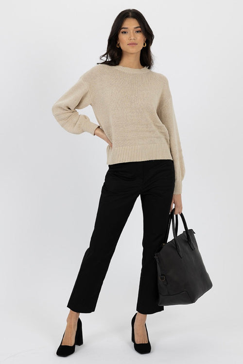 Model wears a beige knit