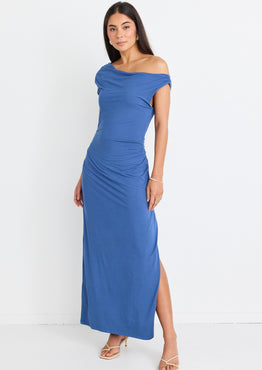 model wears blue off the shoulder maxi dress