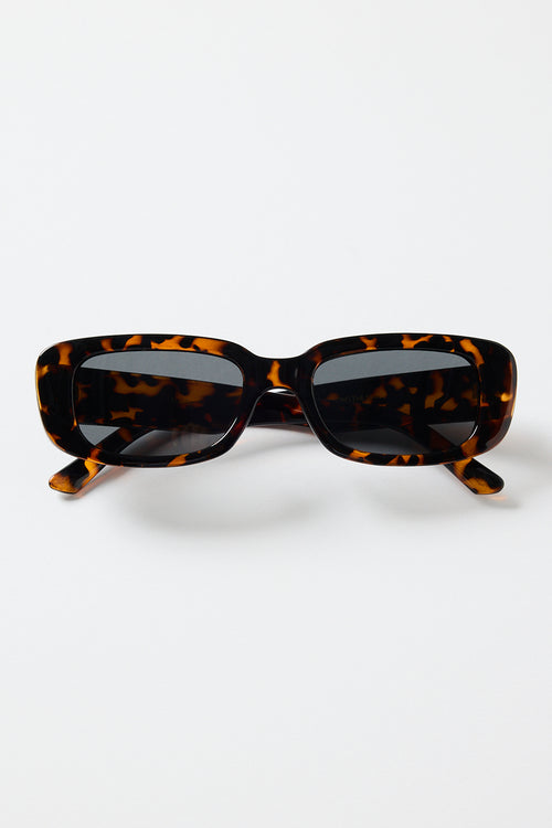 Rectangular brown tortoiseshell sunglasses with dark tinted lenses, photographed on a white background